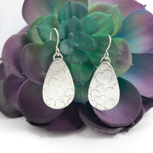 Mandana Studios cute sterling silver earrings with heart texture