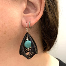 Load image into Gallery viewer, black leather cage earrings with howlite stone shown worn 2
