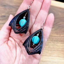 Load image into Gallery viewer, black leather cage earrings with howlite stone
